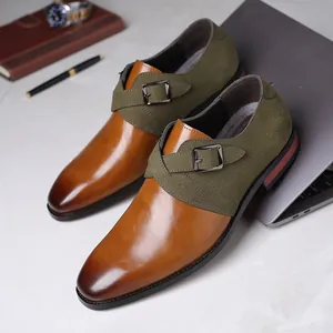 Detail of brown and green two-tone business dress shoes with buckle strap and pointed toe.
