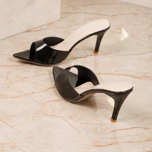 Elegant black patent leather high-heeled mule sandals with a pointed square toe and slim heel