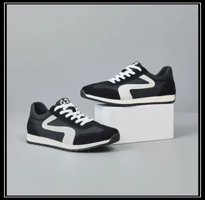 Vue détaillée des baskets rétro pour hommes en cuir noir et blanc patchwork