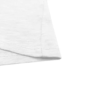 Close-up macro detail of the hem stitching and texture on a white slub cotton t-shirt