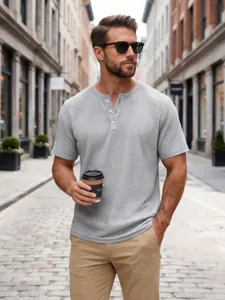 Slim fit short sleeve grey waffle knit Henley shirt for men in casual urban street setting