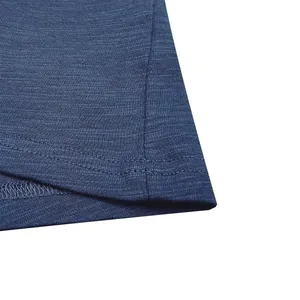 Detail view of navy blue slub cotton texture and durable double-stitched hem on men's T-shirt