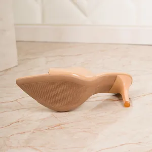 Detailed view of nude high heel mule showing durable non-slip sole and sleek stiletto heel design