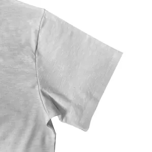Close-up detail of white bamboo-slub cotton texture on men's short sleeve T-shirt
