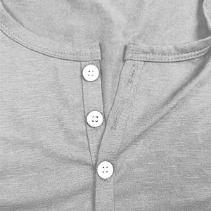 Detailed view of grey slub cotton Henley T-shirt neckline with three white buttons