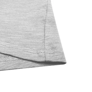 Detailed macro view of a grey faux slub cotton t-shirt showing hem texture and stitching