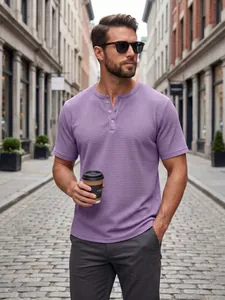 Men's purple waffle-knit short-sleeve Henley shirt styled with casual street outfit.