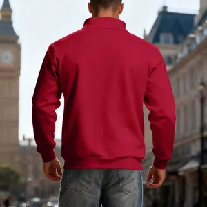 Back view of men's heavyweight red fleece-lined half-zip sweatshirt in outdoor city setting.