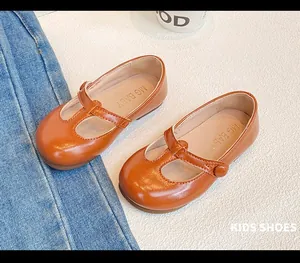 Detailed view of brown toddler girls leather Mary Jane shoes with T-strap and soft anti-slip sole