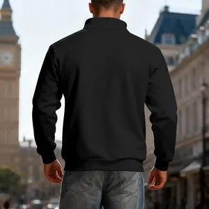 Back view of men's heavyweight black half-zip fleece sweatshirt in urban setting