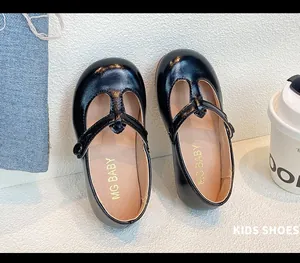 Close-up view of black patent leather T-strap Mary Jane princess shoes for girls