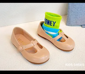 Close-up of pink girls Mary Jane leather shoes featuring a soft non-slip rubber sole