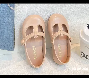 Close-up of beige t-strap Mary Jane shoes for girls with soft non-slip soles for kids