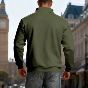 Back view of a men's olive green half-zip stand collar sweatshirt in an urban city setting