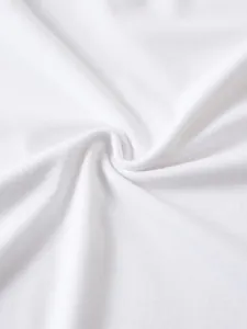 High-quality close-up showing the soft white cotton fabric texture of a men's polo shirt