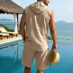 Back view of men's beige linen sleeveless hooded shirt and cargo shorts set in a resort setting