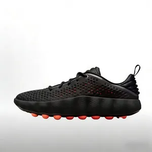 Side view of Mind 002 training shoes with black perforated upper and massage pods