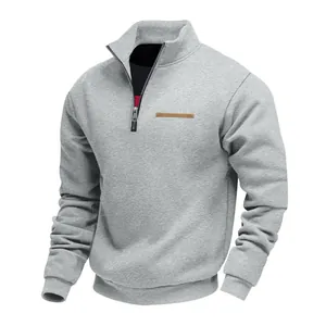 Grey men's half-zip sweatshirt with warm fleece lining for winter outdoor comfort