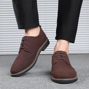 Detail shot of men's dark brown suede Brogue Oxford shoes with lace-up closure