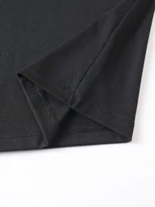 Close-up detail of the precise stitching and hem on a black men's cotton polo shirt