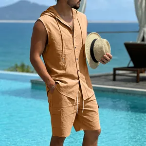 Detail view of a men's orange linen hooded sleeveless shirt and cargo shorts set by a pool