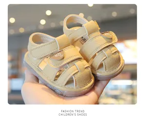 Detailed view of yellow baby walking sandals with soft soles and toe protection