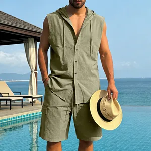 Close-up of model wearing olive green linen hooded shirt and shorts set by pool