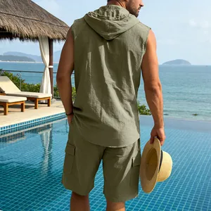 Back view of men's olive linen sleeveless hoodie and cargo shorts set for summer vacation