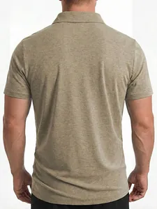 Detail of the back view of a men's khaki short-sleeved casual polo shirt in studio lighting.
