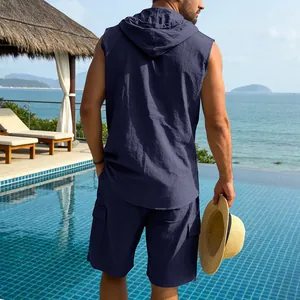 Back view of men's navy blue linen sleeveless hooded shirt and cargo shorts vacation set