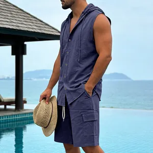 Men's navy blue linen sleeveless hooded shirt and cargo shorts vacation set by a pool