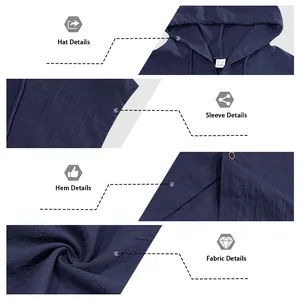 Detail view of navy linen hooded shirt showing hood, sleeve, hem, and fabric texture