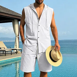 Lifestyle view of a men's white linen hooded sleeveless shirt and cargo shorts beach set