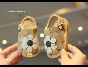 Detailed view of cute baby girl summer sandals featuring flower accent and soft anti-slip sole