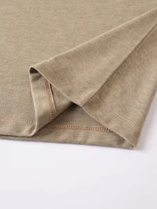High-quality double-needle hem stitching detail on a men's casual khaki knit polo shirt