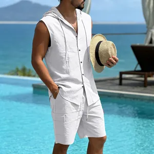 Detail view of men's white linen sleeveless hooded shirt and cargo shorts by the pool