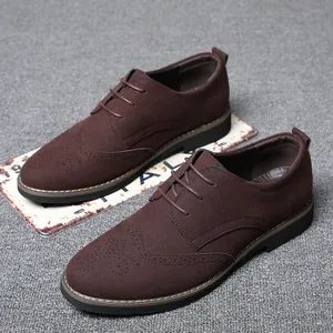 Classic men's brown suede Brogue shoes featuring elegant wingtip perforation detail