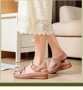 Side view of comfortable women's nude wedge sandals with elegant floral buckle details