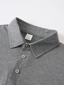 Detailed macro view of gray men's polo shirt collar with size and fabric label