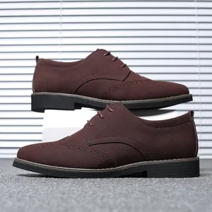 Side view of brown suede Brogue shoes with lace-up detail and classic wingtip stitching.