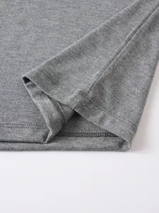 Close-up detail of grey polo shirt sleeve showing high-quality double-needle stitching