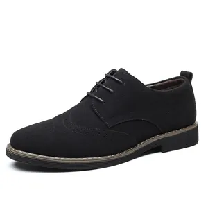 Classic black suede men's Oxford brogue shoes featuring elegant wingtip detailing and lace-up