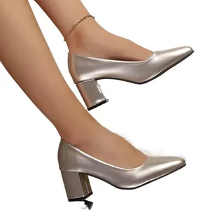 Elegant champagne gold pointed toe pumps featuring comfortable chunky block heels