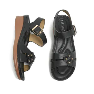Women's black wedge sandals with flower ornaments and gold rivets design.