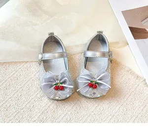 Sparkly silver princess shoes for girls featuring a gray bow and red cherry charms