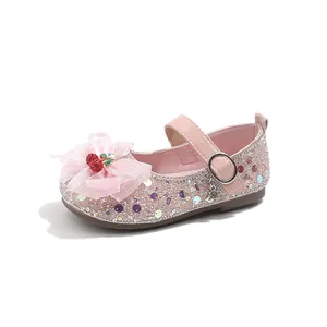Pink sequined girls princess shoes featuring a delicate mesh bow and cherry charm