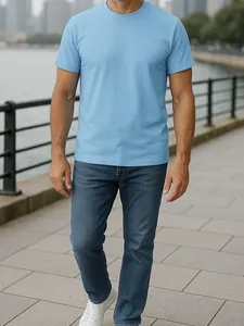 Detail view of a light blue moisture-wicking men's short sleeve T-shirt in outdoor