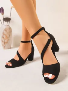 Side view of elegant black suede chunky heel sandals with ankle strap and peep toe