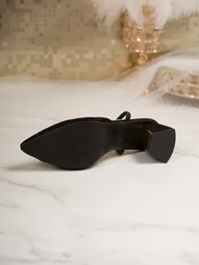 Detailed view of black pointed-toe sandals showing block heel and size 37 mark
