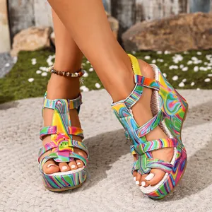 Close-up of colorful psychedelic pattern wedge sandals with platform and straps